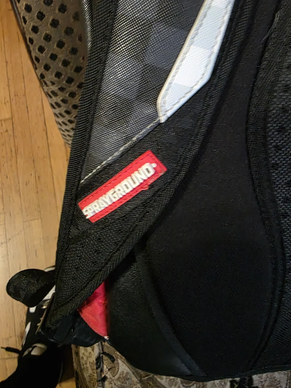 Sprayground Black Checker Shark-Mouth Backpack with White and Red Accents